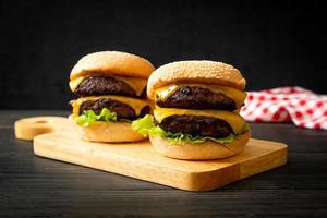 Hamburger or beef burgers with cheese - unhealthy food style photo