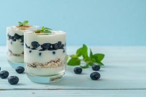 Fresh blueberries and yogurt with granola - Healthy food style photo