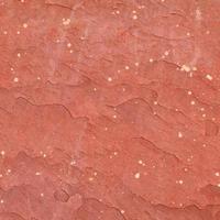 Red rough stone texture background. photo