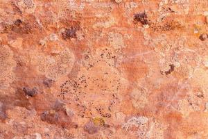 Fondo de textura de pared de arcilla de adobe marrón. foto