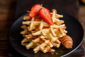 Delicious fresh baked belgian waffles with berries photo