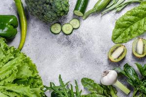 Composition of bright and juicy green vegetables, spices and herbs photo