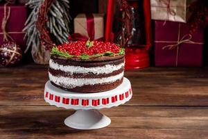 Beautiful delicious cake with bright red berries photo