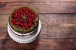 Beautiful delicious cake with bright red berries photo