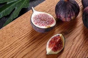 Fresh ripe figs on a dark concrete background. Harvesting figs photo