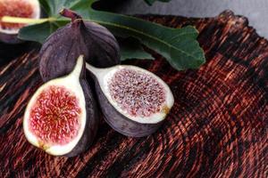 Fresh ripe figs on a dark concrete background. Harvesting figs photo