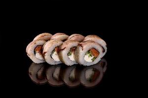 Fresh sushi rolls prepared from the best varieties of fish and seafood photo