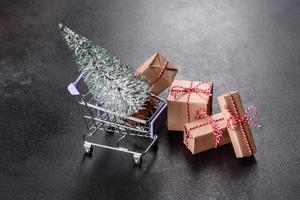 Shopping cart with Christmas gifts and holiday presents photo