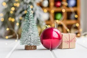 Beautiful multi-colored Christmas decorations on a light wooden table photo