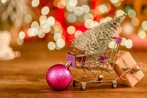Shopping cart with Christmas gifts and presents. Christmas shopping