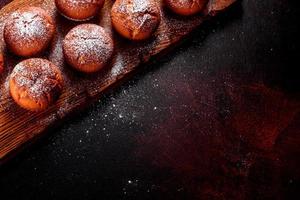 Beautiful delicious fresh cocoa muffins on the Christmas table photo