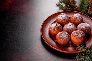 Beautiful delicious fresh cocoa muffins on the Christmas table photo