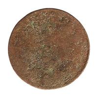 Ancient rusted coin isolated over white photo