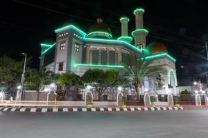 View of the mosque at night in Pekalongan, Indonesia photo