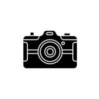 Digital still camera black glyph icon vector