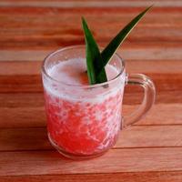 Sago porridge in a glass on a wooden background photo