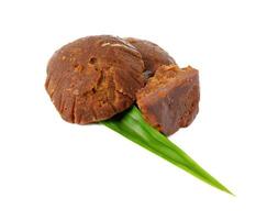 Palm sugar with pandan leaves isolated on a white background photo