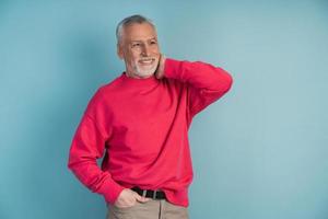 Handsome man in a bright crimson pullover photo