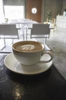 Latte art on hot milk coffee photo
