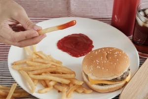 Eating fast foods on the white dish. photo