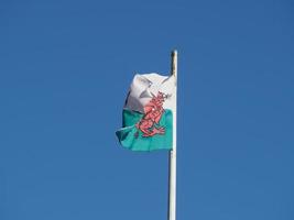 Welsh Flag of Wales over blue sky photo