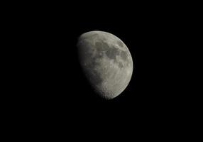 Gibbous moon seen with telescope photo