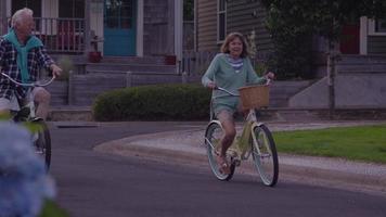 Senior couple riding bicycles together video