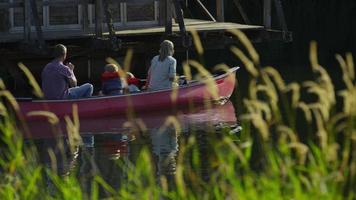 Family paddling canoe video