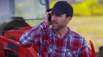 Farmer talking on cell phone video
