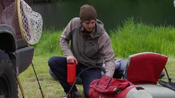 Fly fisherman pumping up float tube video