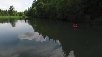 Aerial view of fly fishermen on lake video