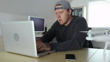 Man in office working with drone video