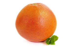 Grapefruit on a white plate with a sprig of mint. Isolate. photo