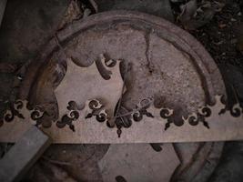 abstract wooden pattern on rusty iron cover on the ground photo