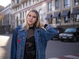 attractive girl with gorgeous hair in a denim jacket photo