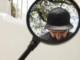 man with a beard takes pictures of himself in the mirror photo