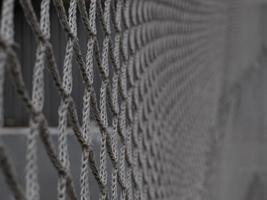 soccer goal net close-up. football or other sport playground grey net photo