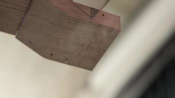 man sawing a piece from a oak board using a hand saw video