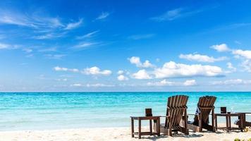 Summer vacation background with deckchairs photo