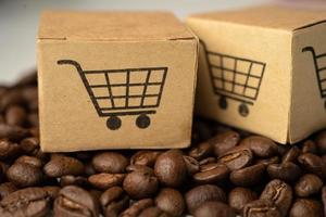 Box with shopping cart logo symbol on coffee beans, photo