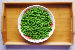 Fresh organic peas in a bowl , photo