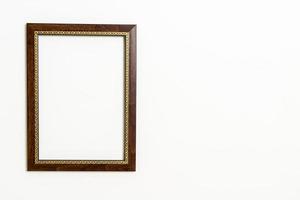 Empty picture frame on white wall background with copy space photo