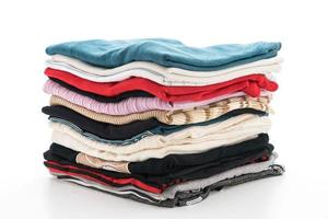 Stacks of clothing on white background photo