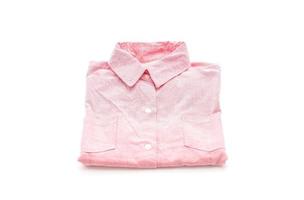 Pink shirt folded on white background photo