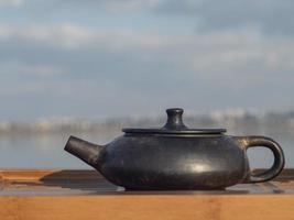 Yixing clay pot of black color after firing outdoor. photo