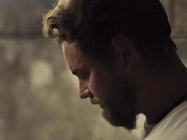 profile portrait of a man with a beard. hipster photo