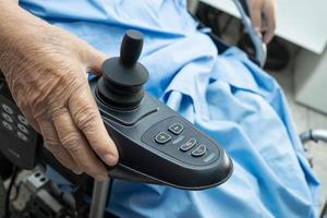 Asian senior woman patient on electric wheelchair photo