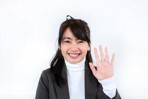 Beautiful  business woman waving for greeting video conference photo