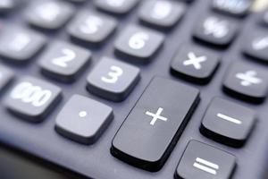 Close up calculator on wood table photo