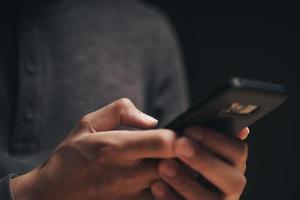 Man using a smartphone internet, searching, browsing, social media photo